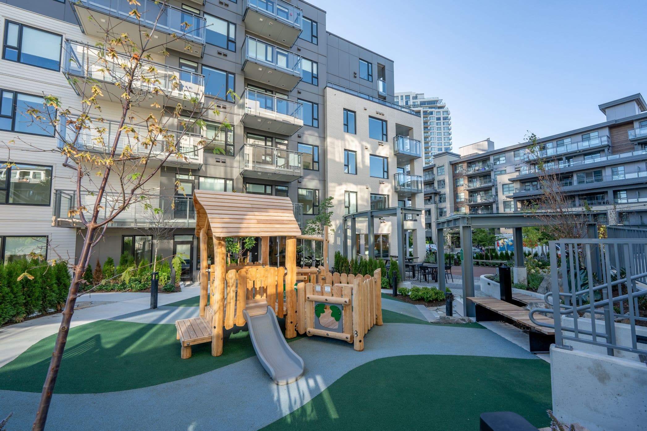 The children’s play structure and slide in the Seasons courtyard