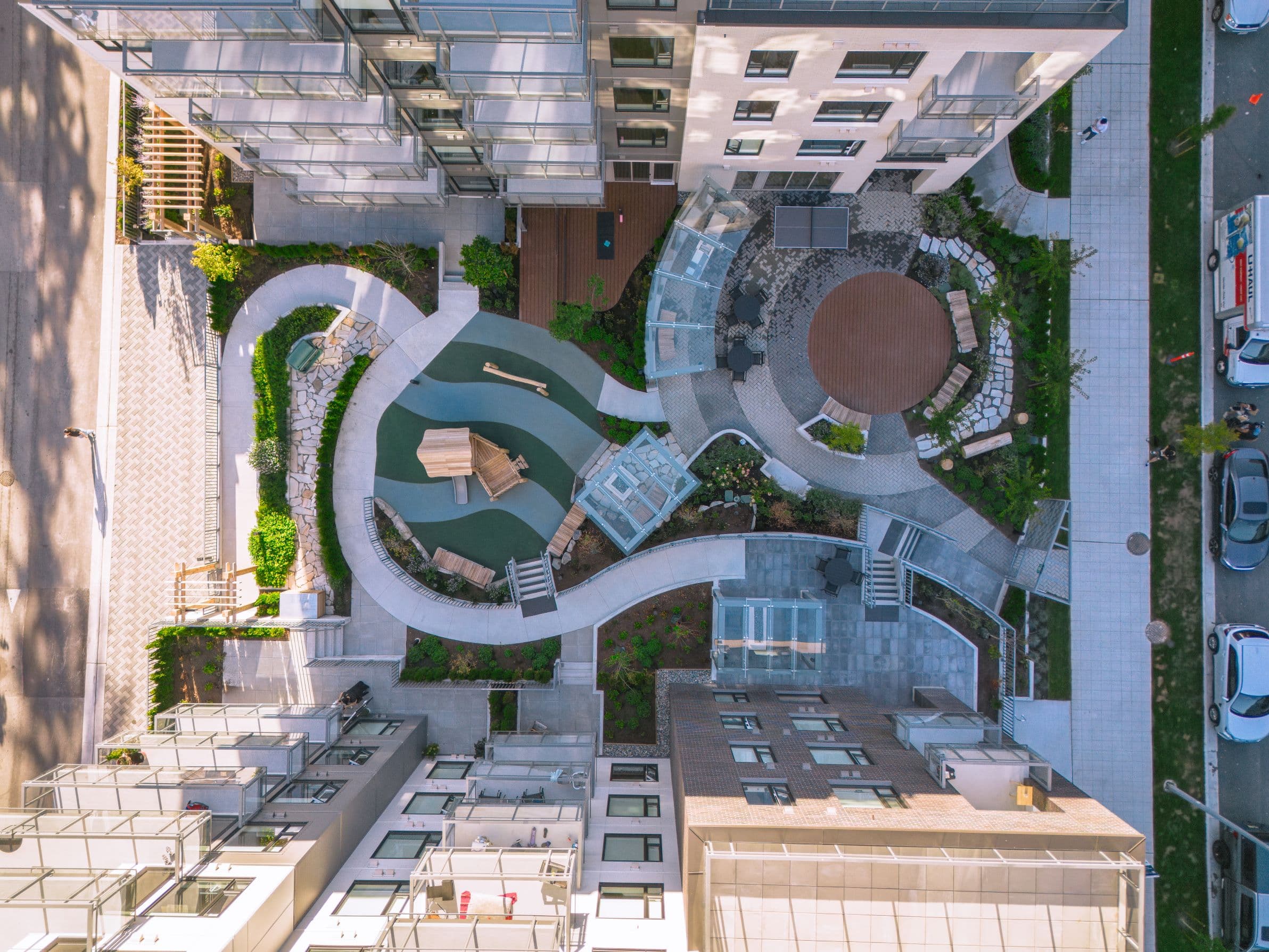 The courtyard from directly above — winding paths, planting and seating